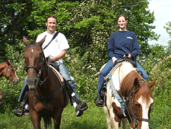 Jeremy and Megan riding horses in Boone